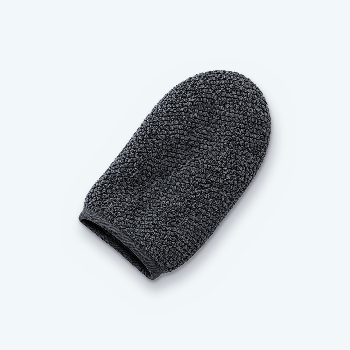 Anti-kalk Handsken i grå mikrofiber uden tommelfinger – på lyseblå baggrund